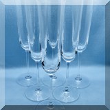 G09. Set of 9 Riedel champagne flutes. 9.5”h - $90 